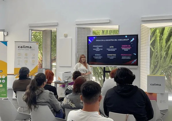 A talk in front of an audience at the Calima office